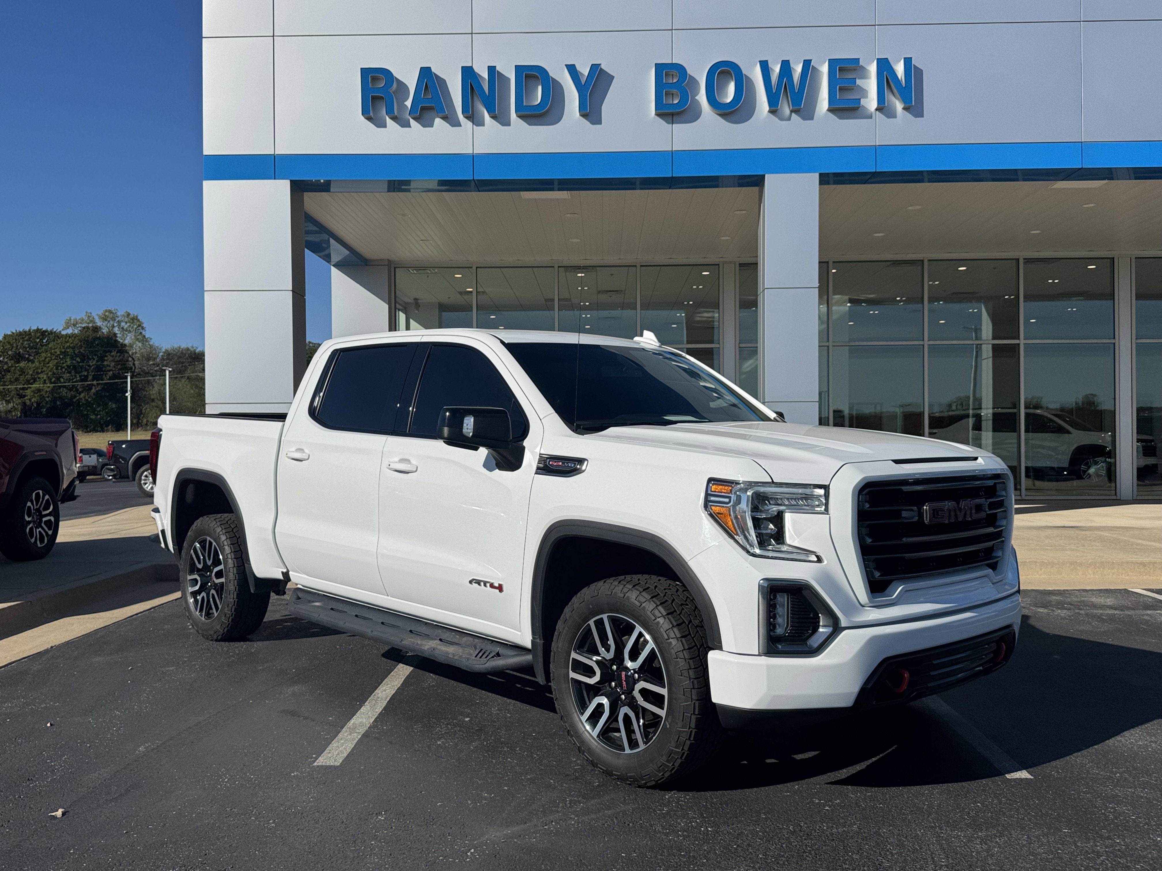 2021 GMC Sierra 1500 AT4 in Summit White — front three-quarter view